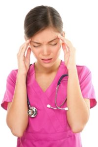 20871139 - nurse / doctor with migraine headache overworked and stressed