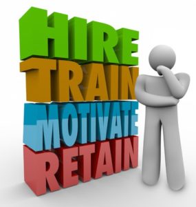 36935808 - hire, train, motivate and retain 3d words beside a thinker to illustrate human resources practices to improve employee satisfaction and retention